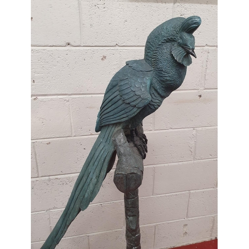 879 - A large Bronze Bird Sculpture on stand. H 146 cms approx.