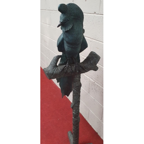 879 - A large Bronze Bird Sculpture on stand. H 146 cms approx.