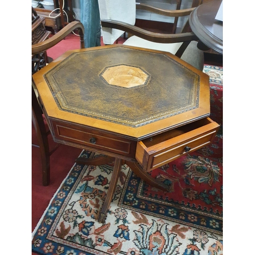 885 - A nice Yew wood octagonal Centre Table/Drum Table with leather insert. D 60 x H 65 cms approx.