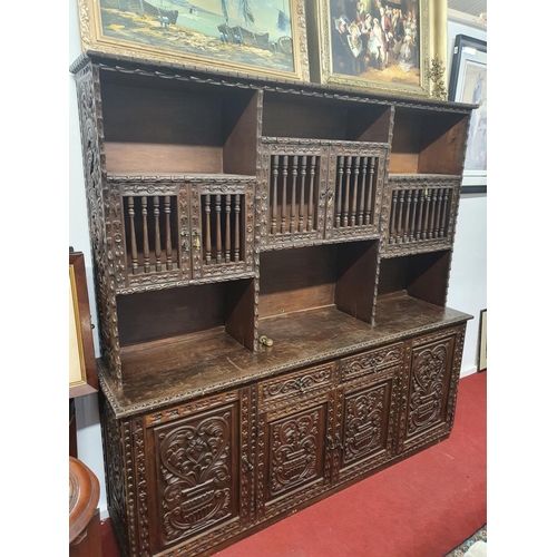 891 - A superb 20th Century highly carved Oriental style Cabinet with raised back. W195 x D46 x H 191cm ap... 