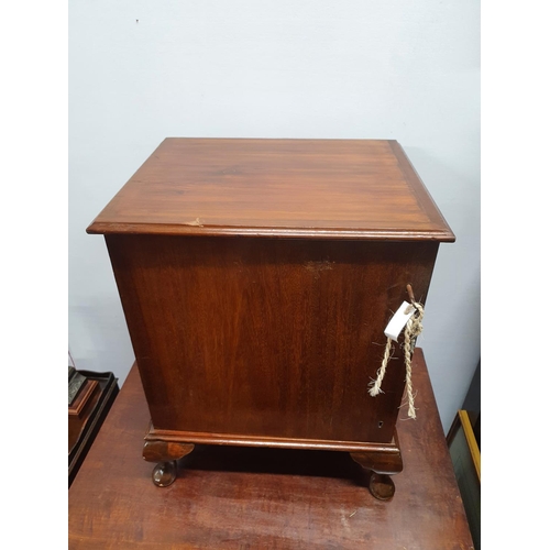 1003 - A small unusual mahogany and stained pine table top collectors cabinet enclosed by a single door fit... 