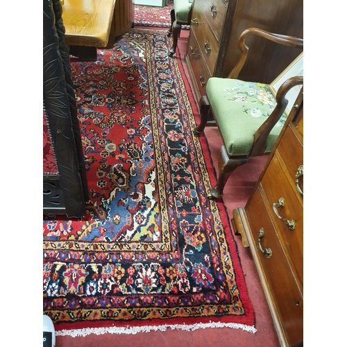 1008 - A Persian Soruk red ground full pile Rug with a traditional medallion design, multi borders and all ... 