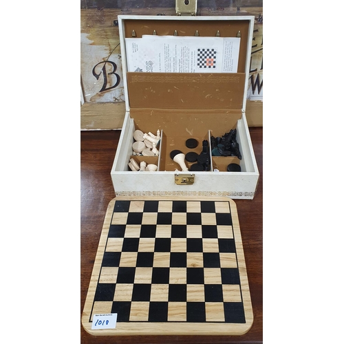 1018 - A quantity of Chess and draughts Pieces and Board.