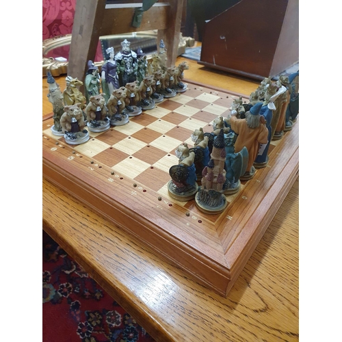 1023 - A set of hand painted Lord of the Rings Chess Pieces on a modern Chess Board.