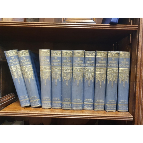 973 - 1 leather volume of The Public Acts along with 10 volumes of the Children's Encyclopedia.