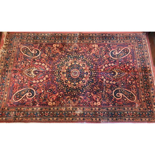 957 - A good Persian Rug with Burgundy ground and all over unique design. 220 x 139 cms approx.