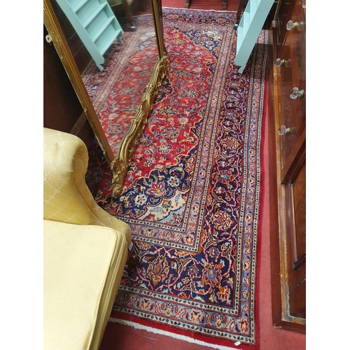 954 - A red ground Persian Carpet with a unique design. 195 x 305 cms approx.