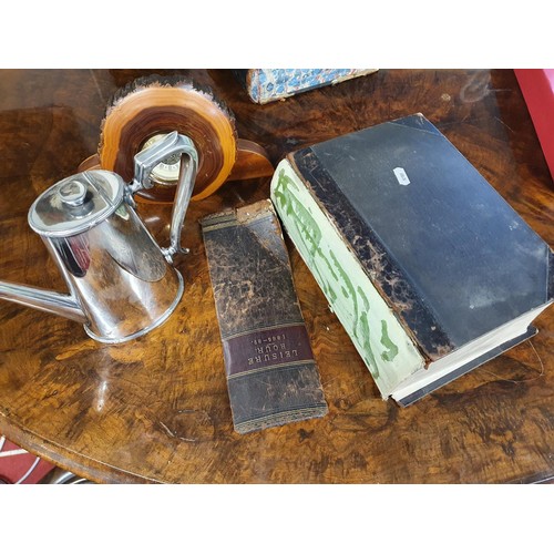 777 - A silver plated Coffee Pot, timber Clock, along with two antiquarian Books.