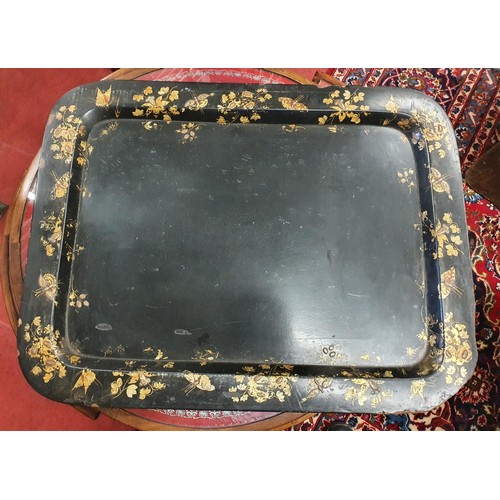 864a - A 19th century lacquered tray, decorated foliage and butterflies, some loss, 78 x 58 cm along with a... 