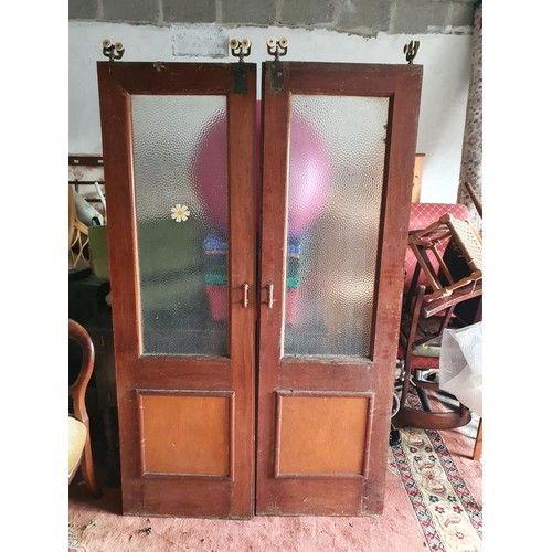 1060a - Two pairs of Vintage Doors along with a revolving shop Advertising.