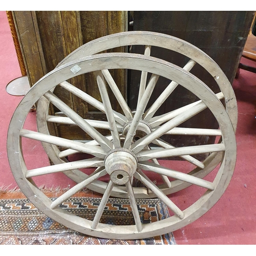 653 - A pair of Timber Wheels with metal strapping. 73D cms approx.