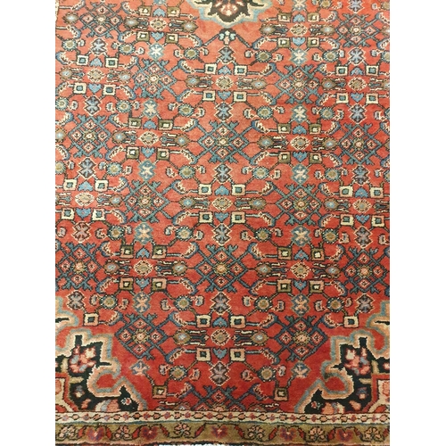 326 - A Persian red ground Carpet.295x120 cms approx.