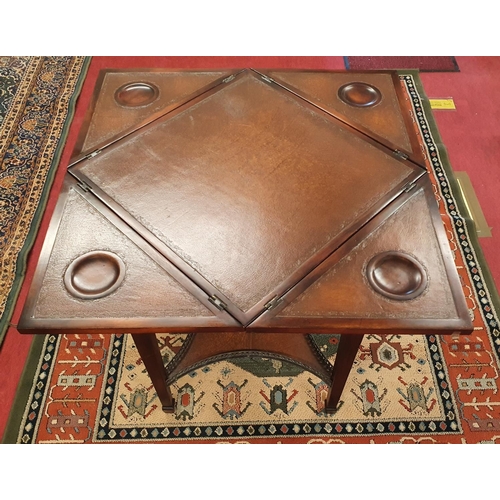 117 - A Mahogany envelope Card Table with leather inserts.