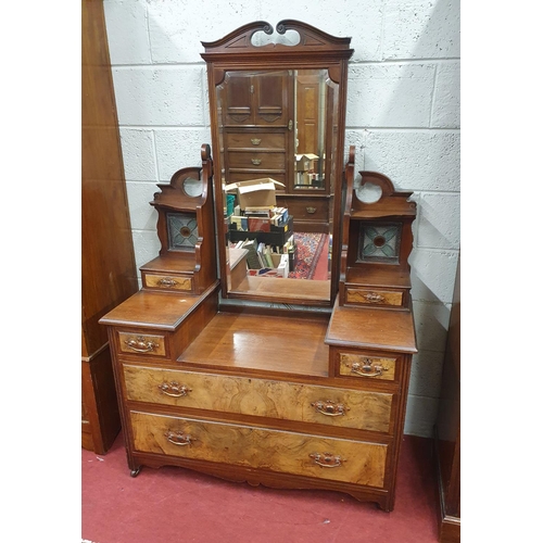 220 - A late 19th Century Walnut three door Wardrobe along with its Dressing Table partner and another sin... 