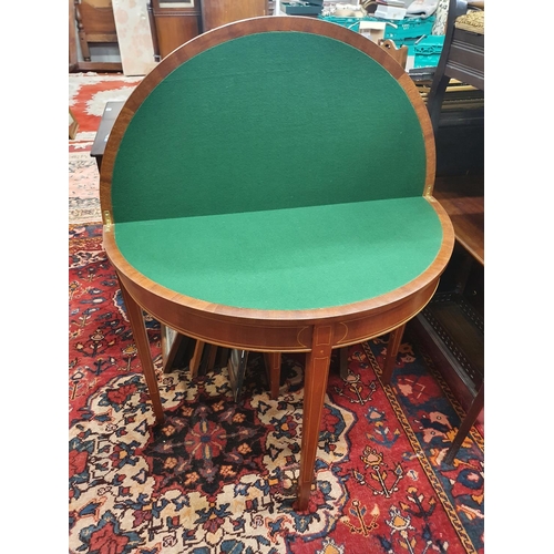 262 - A Mahogany and inlaid fold over Card Table with baized interior.