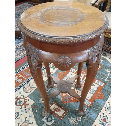 329 - A really good late 19th Century Oak circular Pedestal Stand with a highly carved outline.