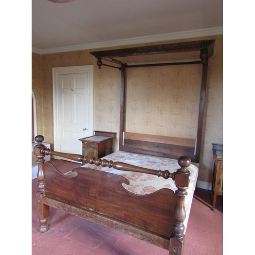 213 - A Victorian walnut half tester bedstead, the footboard with turned rail and supports.