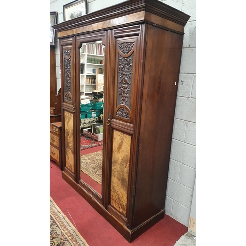 179 - A late 19th Century Walnut three door Wardrobe along with its Dressing Table partner and another sin... 