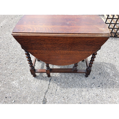 190 - A Lloyd Loom Blanket Bin, Pine Kitchen Table, and an Oak Gate legged Table.