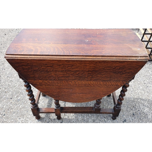 190 - A Lloyd Loom Blanket Bin, Pine Kitchen Table, and an Oak Gate legged Table.