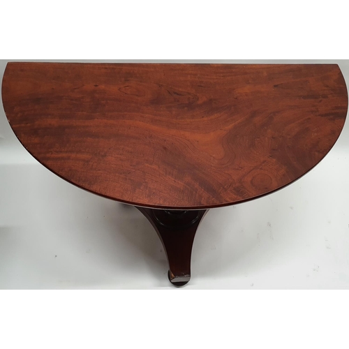 235 - An early 19th Century Mahogany Half Moon Table of neat proportions on a centre shafted pod. W 113 X ... 