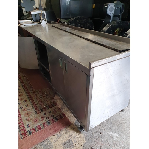 336 - A very large kitchen Press with heated serving top. 285W x 80D x 90H cms approx.