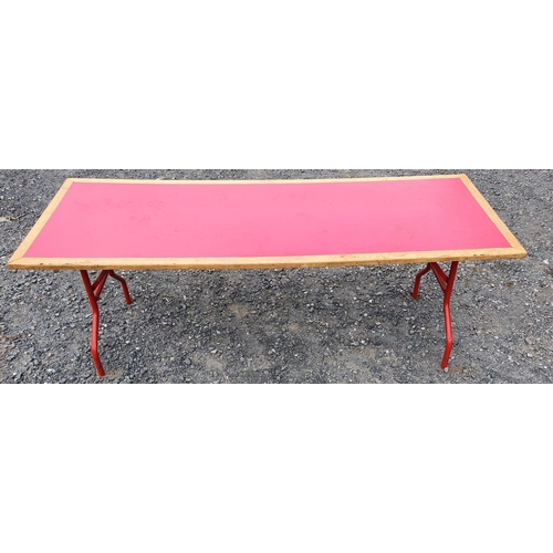 386 - A wooden Fold Up Table with red top. 185W x 60D x 65H cms approx.