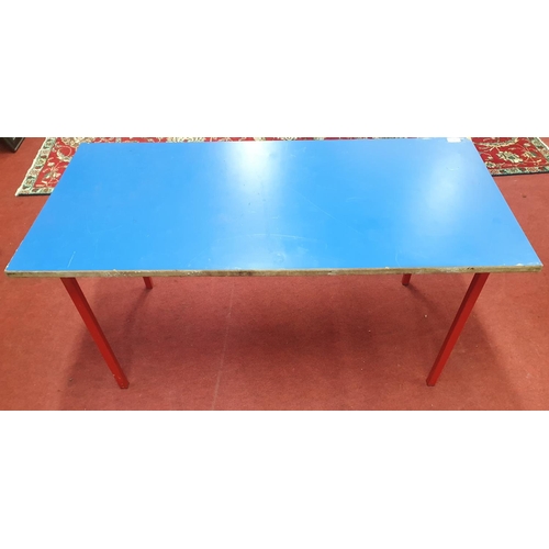 391 - A wooden Table with metal legs and a blue top. 4ft x 2ft x 2ft approx. (W X D X H).