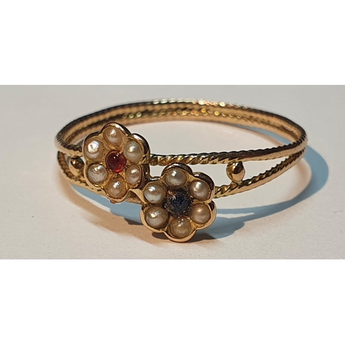 303 - A split pearl and gem-set floral dress ring.
Ring size P. 1.2gms.
