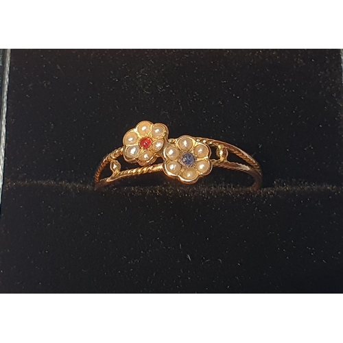303 - A split pearl and gem-set floral dress ring.
Ring size P. 1.2gms.
