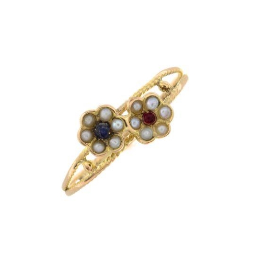 303 - A split pearl and gem-set floral dress ring.
Ring size P. 1.2gms.