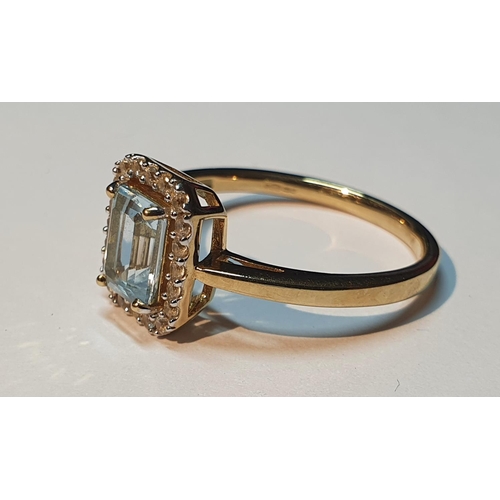 305 - A 9ct gold blue topaz cluster ring. Hallmarks for 9ct gold, partially indistinct. Ring size P. 2.7gm... 