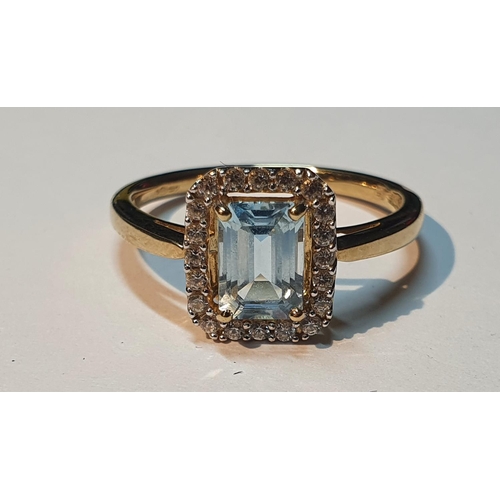 305 - A 9ct gold blue topaz cluster ring. Hallmarks for 9ct gold, partially indistinct. Ring size P. 2.7gm... 