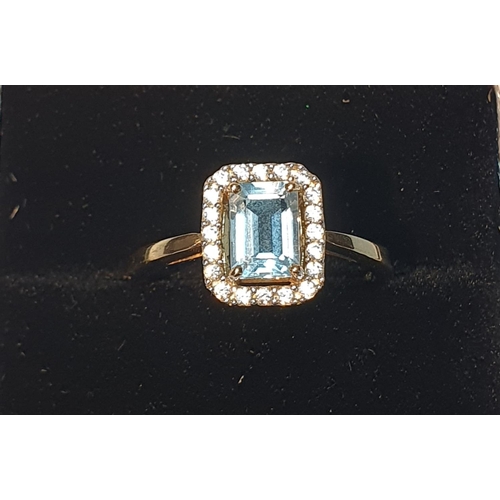305 - A 9ct gold blue topaz cluster ring. Hallmarks for 9ct gold, partially indistinct. Ring size P. 2.7gm... 