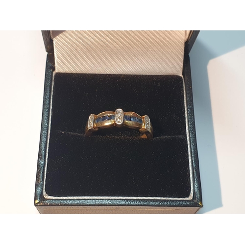 307 - 9ct gold sapphire and diamond band ring, hallmarks for London, ring size M, 2.6gms.