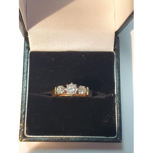 312 - An 18ct gold brilliant-cut diamond three-stone ring. Estimated total diamond weight 0.50ct, H-I colo... 