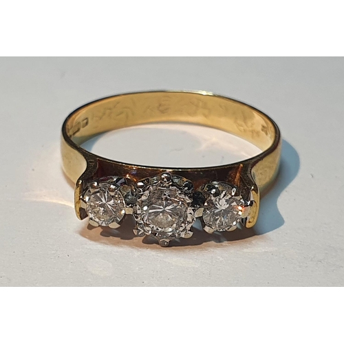 312 - An 18ct gold brilliant-cut diamond three-stone ring. Estimated total diamond weight 0.50ct, H-I colo... 