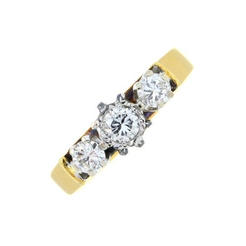 312 - An 18ct gold brilliant-cut diamond three-stone ring. Estimated total diamond weight 0.50ct, H-I colo... 