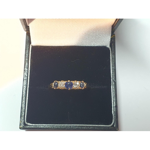 313 - An 18ct gold sapphire and old-cut diamond five-stone ring. Estimated total diamond weight 0.20ct, H-... 