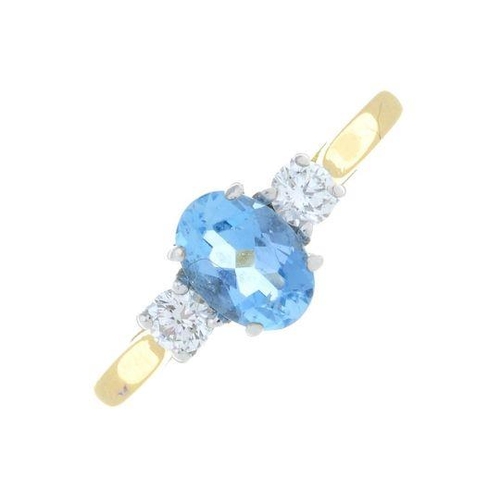 315 - An 18ct gold topaz and brilliant-cut diamond three-stone ring.