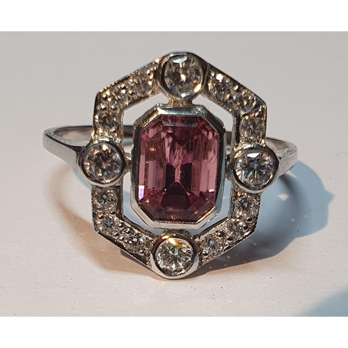 317 - A pink tourmaline and brilliant-cut diamond cluster ring. Tourmaline calculated weight 1.10cts, base... 