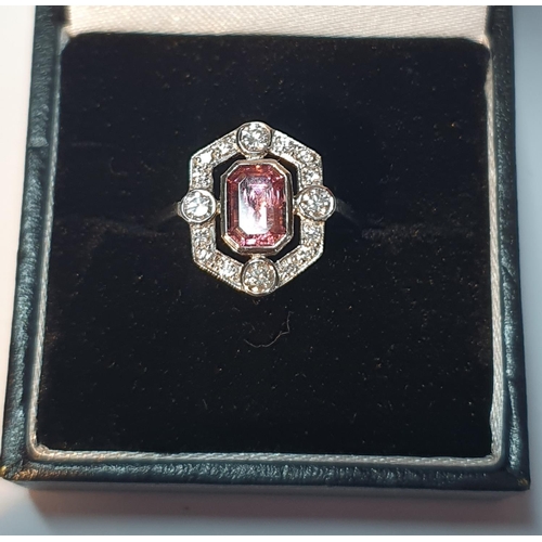 317 - A pink tourmaline and brilliant-cut diamond cluster ring. Tourmaline calculated weight 1.10cts, base... 