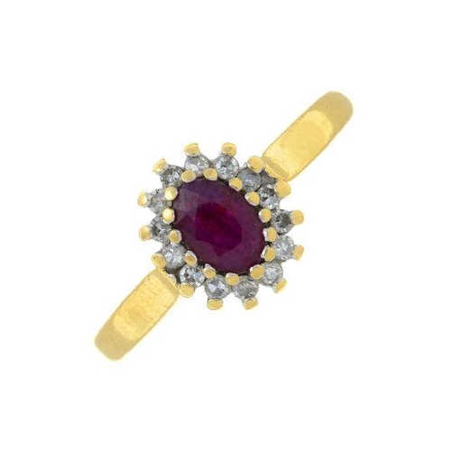 318 - An 18ct gold ruby and diamond cluster ring. Estimated total diamond weight 0.15ct. Hallmarks for 18c... 