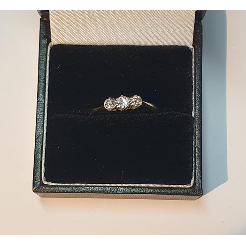 320 - A diamond three-stone ring. Estimated total diamond weight 0.35ct, principal diamond estimated H-I c... 