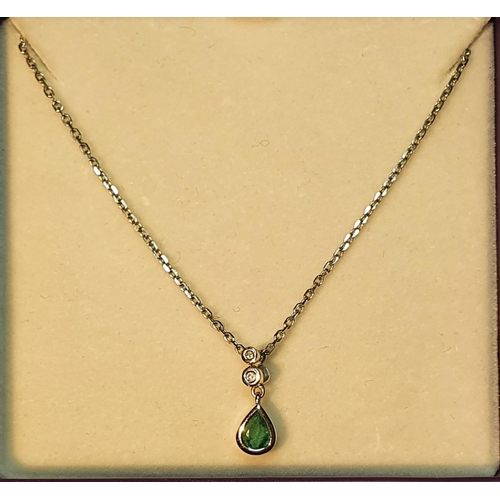 324 - Emerald and diamond pendant, suspended from a 9ct gold chain, hallmarks for Sheffield, stamped 375, ... 