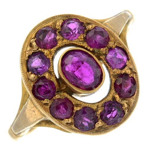 325 - Ruby cluster ring, stamped 9ct, ring size L1/2, 3.3gms.