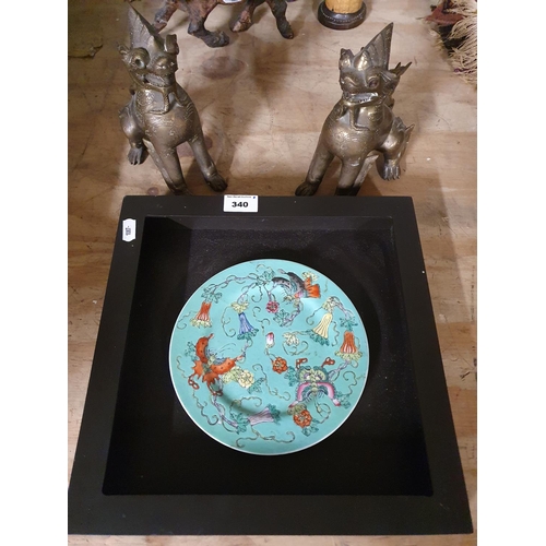 340 - An Oriental Plate along with two heavy Dogs of Foo.