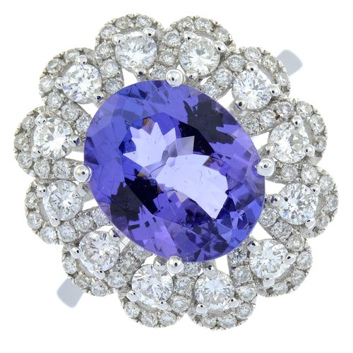 300 - An 18ct Gold tanzanite and diamond dress ring. Tanzanite weight 3.71cts. Total diamond weight 0.99ct... 