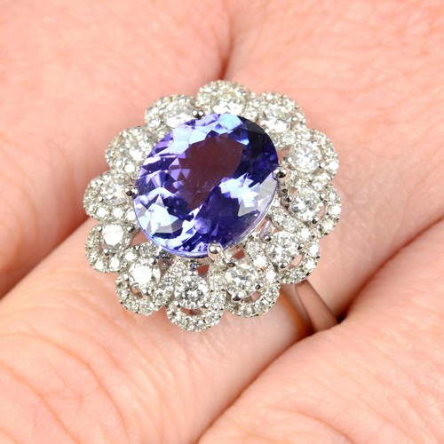 300 - An 18ct Gold tanzanite and diamond dress ring. Tanzanite weight 3.71cts. Total diamond weight 0.99ct... 