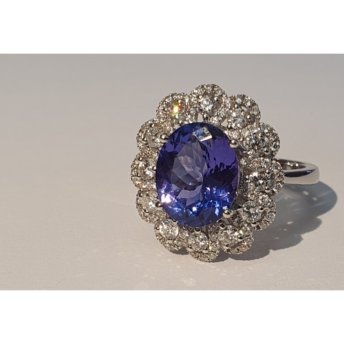 300 - An 18ct Gold tanzanite and diamond dress ring. Tanzanite weight 3.71cts. Total diamond weight 0.99ct... 